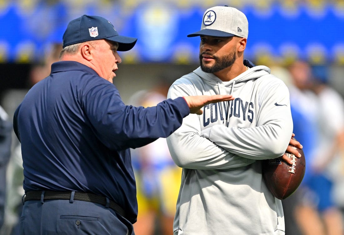 Oct 9, 2022; Inglewood, California, USA; Dallas Cowboys head coach Mike McCarthy talks with quarterback Dak Prescott (4) on the field prior to the game against the Los Angeles Rams at SoFi Stadium. Mandatory Credit: Jayne Kamin-Oncea-USA TODAY Sports