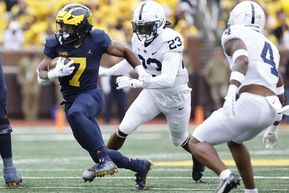 Oct 15, 2022; Ann Arbor, Michigan, USA;  Michigan Wolverines running back Donovan Edwards (7) rushes in the first half against the Penn State Nittany Lions at Michigan Stadium. Mandatory Credit: Rick Osentoski-USA TODAY Sports