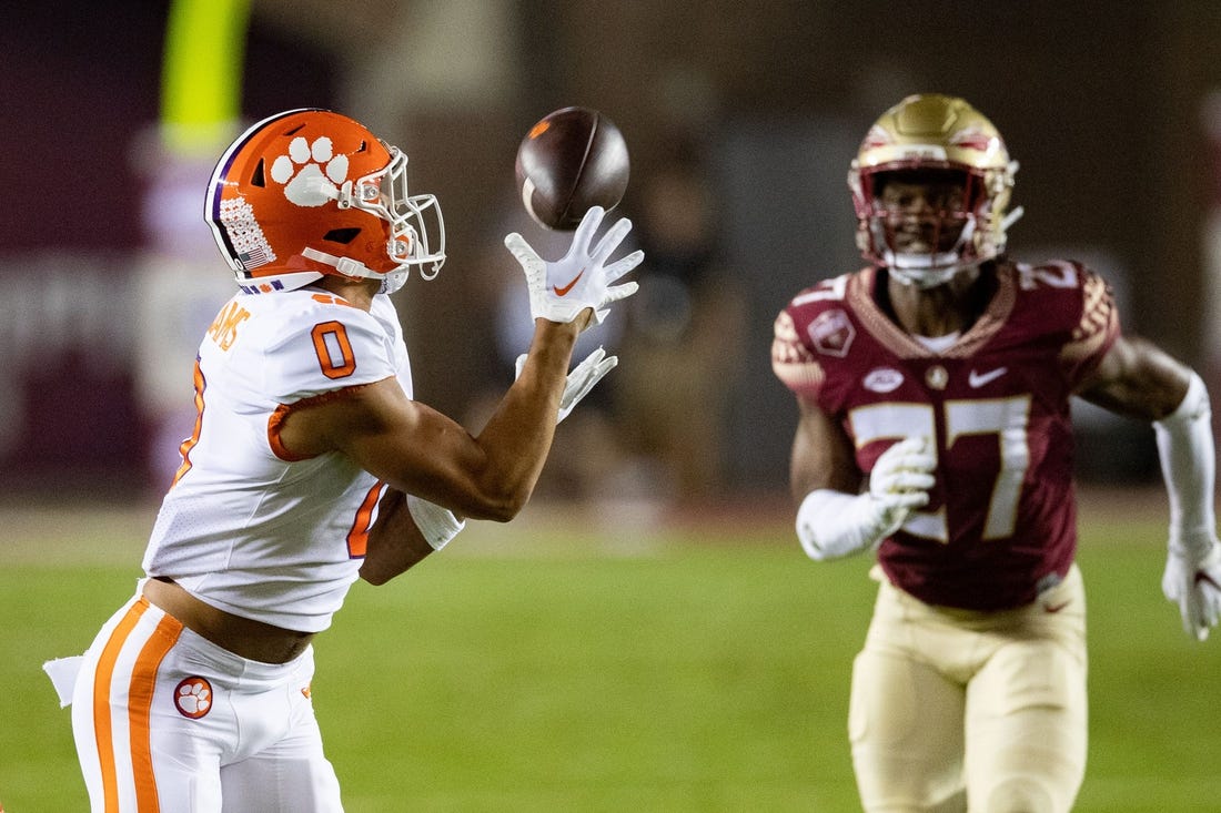 Clemson Tigers wide receiver Antonio Williams (0) catches a pass from Clemson Tigers quarterback DJ Uiagalelei (5). The Clemson Tigers lead the Florida State Seminoles 24-14 at the half during an ACC game at Doak Campbell Stadium on Saturday, Oct. 15, 2022.

Fsu V Clemson First303