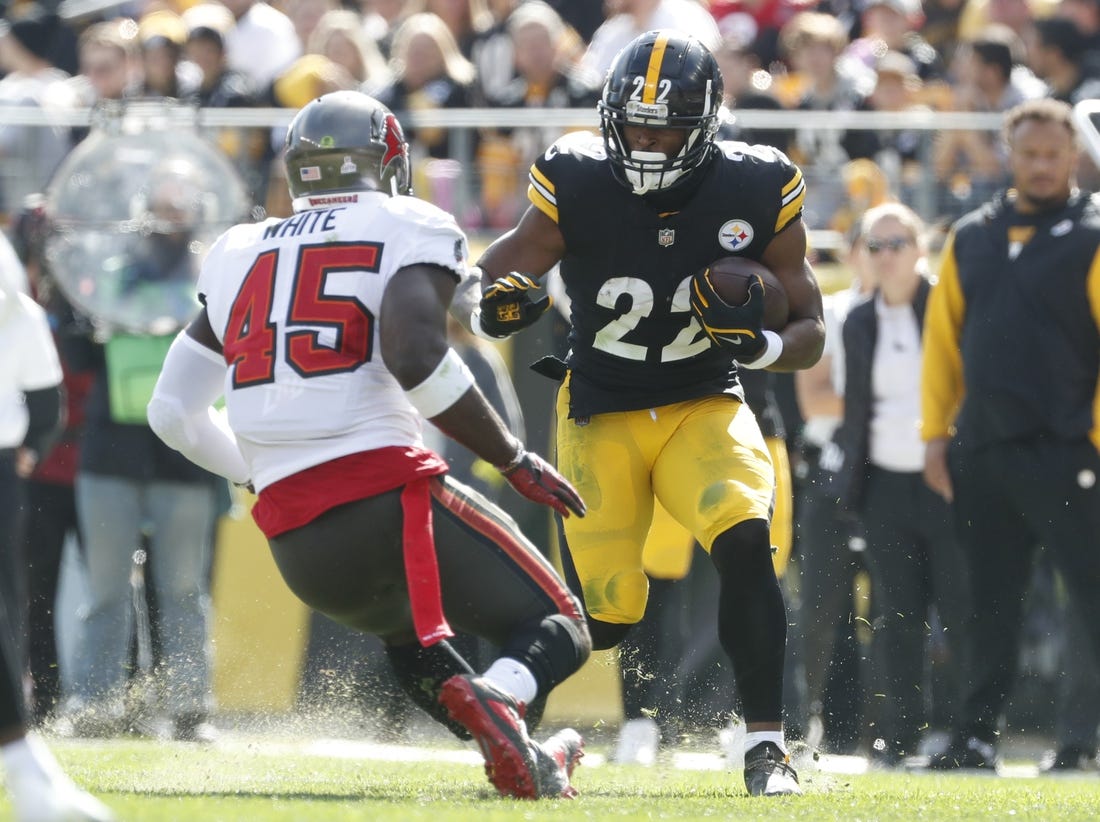 Oct 16, 2022; Pittsburgh, Pennsylvania, USA;  Pittsburgh Steelers running back Najee Harris (22) runs the ball against Tampa Bay Buccaneers linebacker Devin White (45) during the second quarter at Acrisure Stadium. Mandatory Credit: Charles LeClaire-USA TODAY Sports