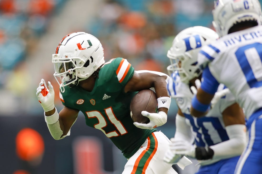 Oct 22, 2022; Miami Gardens, Florida, USA; Miami Hurricanes running back Henry Parrish Jr. (21) runs with the football during the first quarter against the Duke Blue Devils at Hard Rock Stadium. Mandatory Credit: Sam Navarro-USA TODAY Sports