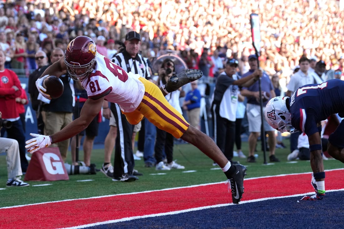 Oct 29, 2022; Tucson, Arizona, USA; USC Trojans wide receiver Kyle Ford (81) is unable to get his feet down for a catch against Arizona Wildcats cornerback Ephesians Prysock (7) during the first half at Arizona Stadium. Mandatory Credit: Joe Camporeale-USA TODAY Sports