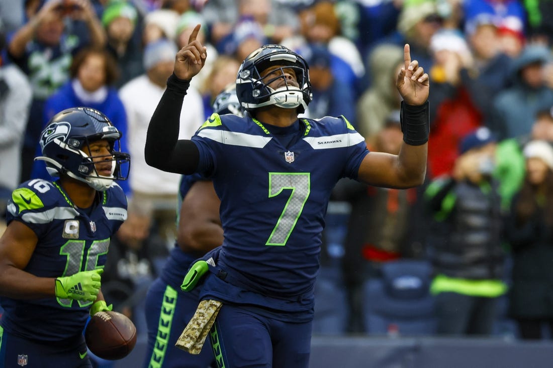 Oct 30, 2022; Seattle, Washington, USA; Seattle Seahawks quarterback Geno Smith (7) celebrates after throwing a touchdown pass to wide receiver Tyler Lockett (16) during the fourth quarter against the New York Giants at Lumen Field. Mandatory Credit: Joe Nicholson-USA TODAY Sports