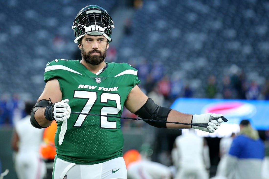 Nov 14, 2021; East Rutherford, New Jersey, USA; New York Jets offensive tackle Laurent Duvernay-Tardif (72) unwraps his taped hand as he leaves the field after losing to the Buffalo Bills at MetLife Stadium. Mandatory Credit: Brad Penner-USA TODAY Sports