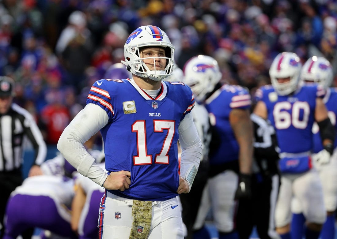 Bills quarterback Josh Allen  walks of the field after fumbling the snap that turned into a Vikings touchdown.