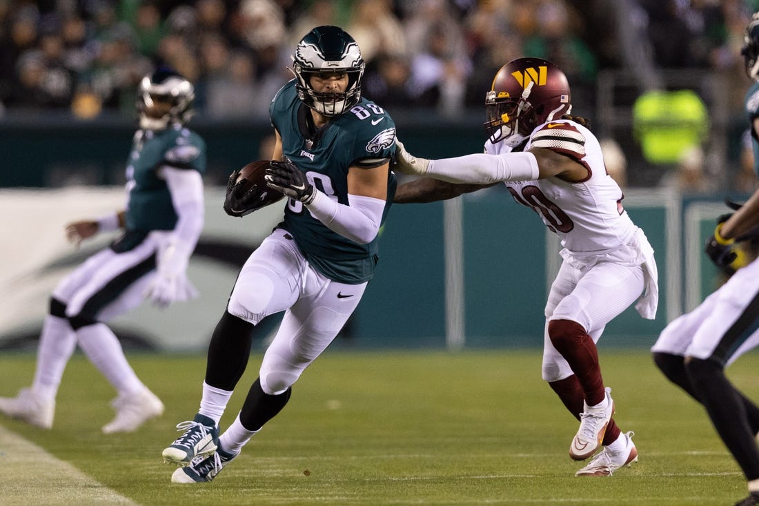 Nov 14, 2022; Philadelphia, Pennsylvania, USA; Philadelphia Eagles tight end Dallas Goedert (88) runs with the ball against Washington Commanders safety Bobby McCain (20) after a catch during the third quarter at Lincoln Financial Field. Mandatory Credit: Bill Streicher-USA TODAY Sports
