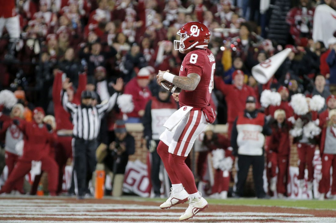 Nov 19, 2022; Norman, Oklahoma, USA; Oklahoma Sooners quarterback Dillon Gabriel (8) runs for a touchdown against the Oklahoma State Cowboys during a game at Gaylord Family-Oklahoma Memorial Stadium. Mandatory Credit: Bryan Terry-USA TODAY Sports