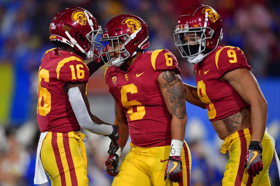 Nov 19, 2022; Pasadena, California, USA; Southern California Trojans running back Austin Jones (6) celebrates his touchdown scored against the UCLA Bruins with wide receiver Tahj Washington (16) and wide receiver Michael Jackson III (9) during the first half at the Rose Bowl. Mandatory Credit: Gary A. Vasquez-USA TODAY Sports