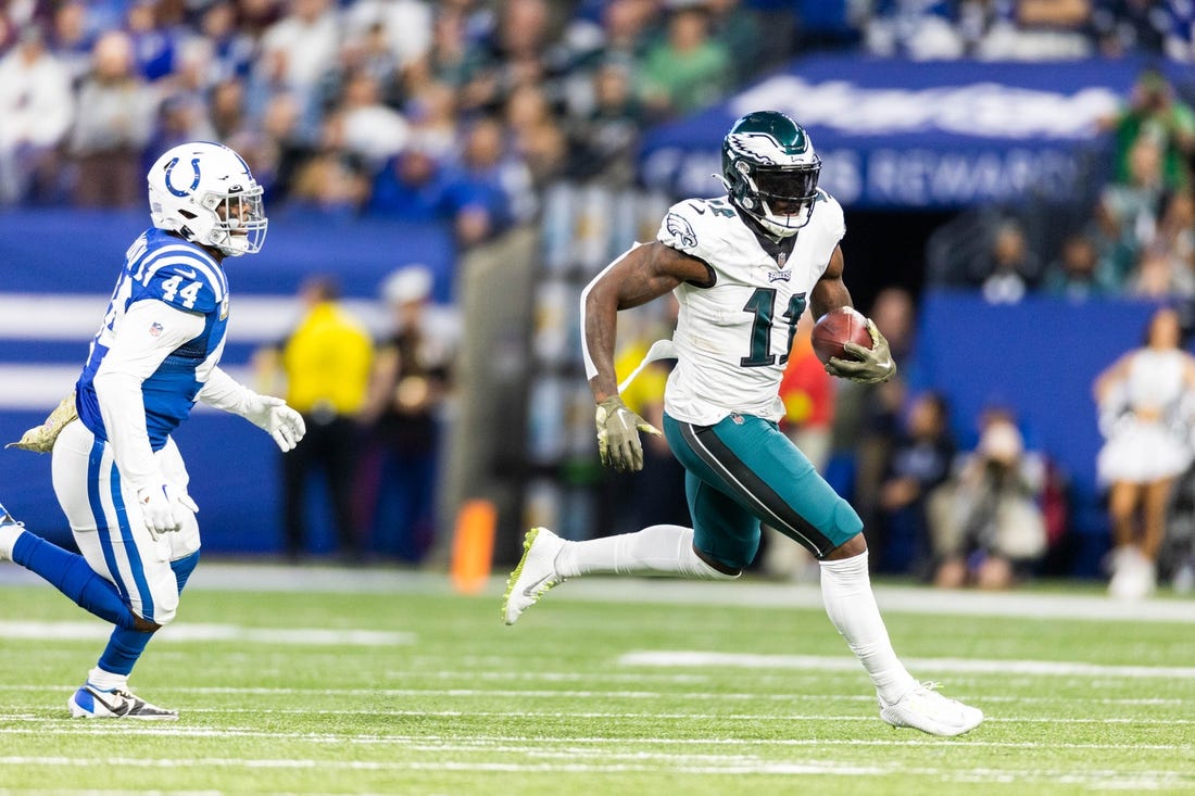 Nov 20, 2022; Indianapolis, Indiana, USA; Philadelphia Eagles wide receiver A.J. Brown (11) runs with the ball while Indianapolis Colts linebacker Zaire Franklin (44) defends in the first quarter at Lucas Oil Stadium. Mandatory Credit: Trevor Ruszkowski-USA TODAY Sports