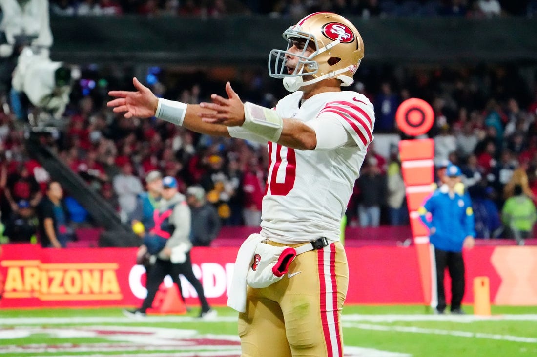 Nov 21, 2022; Mexico City, MEX; San Francisco 49ers quarterback Jimmy Garoppolo (10) celebrates after his touchdown pass against the Arizona Cardinals during the second half at Estadio Azteca. Mandatory Credit: Rob Schumacher-USA TODAY Sports