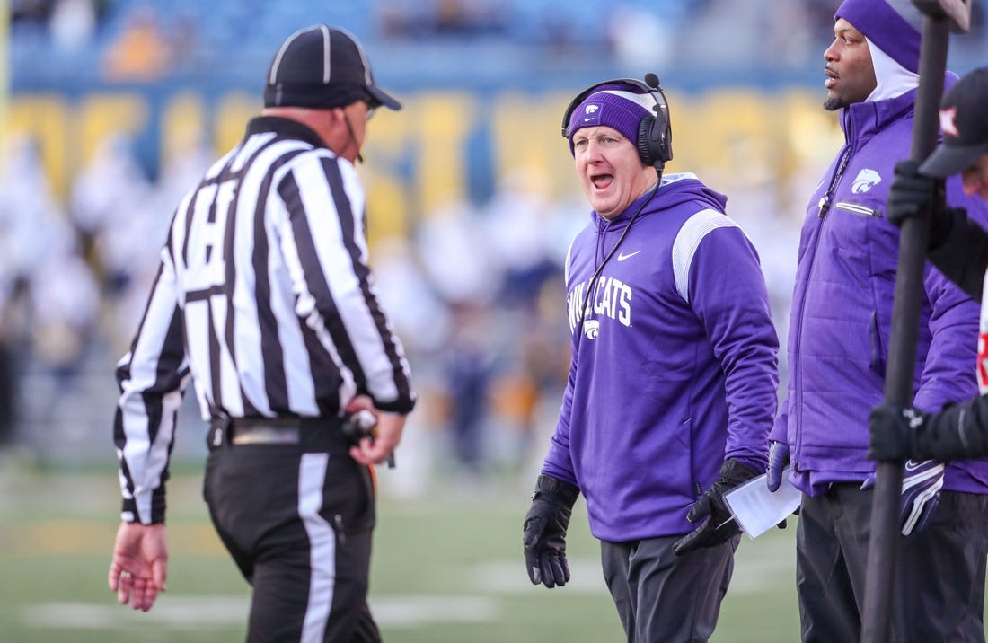 Nov 19, 2022; Morgantown, West Virginia, USA; Kansas State Wildcats head coach Chris Klieman talks to an official along the sidelines during the third quarter against the West Virginia Mountaineers at Mountaineer Field at Milan Puskar Stadium. Mandatory Credit: Ben Queen-USA TODAY Sports