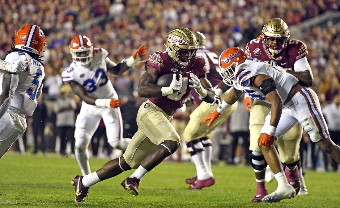 Nov 25, 2022; Tallahassee, Florida, USA; Florida State Seminoles running back Trey Benson (3) runs for a touchdown during the first quarter against the Florida Gators at Doak S. Campbell Stadium. Mandatory Credit: Melina Myers-USA TODAY Sports
