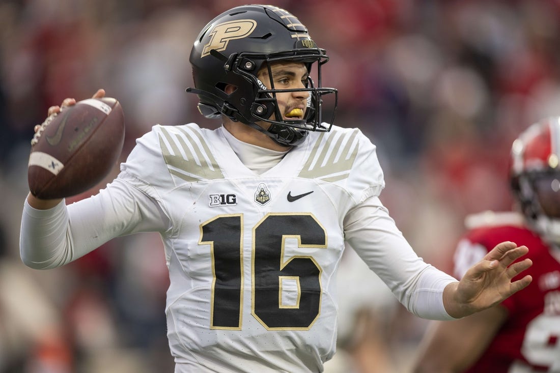 Nov 26, 2022; Bloomington, Indiana, USA;  Purdue Boilermakers quarterback Aidan O'Connell (16) looks to throw a quick pass during the second quarter against the Indiana Hoosiers at Memorial Stadium. Mandatory Credit: Marc Lebryk-USA TODAY Sports