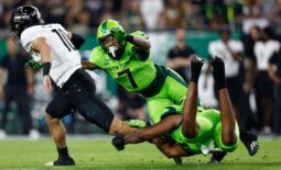 Nov 26, 2022; Tampa, Florida, USA; UCF Knights quarterback John Rhys Plume (10) scrambles with the ball as South Florida Bulls safety Will Jones II (7) defends during the first quarter at Raymond James Stadium. Mandatory Credit: Douglas DeFelice-USA TODAY Sports