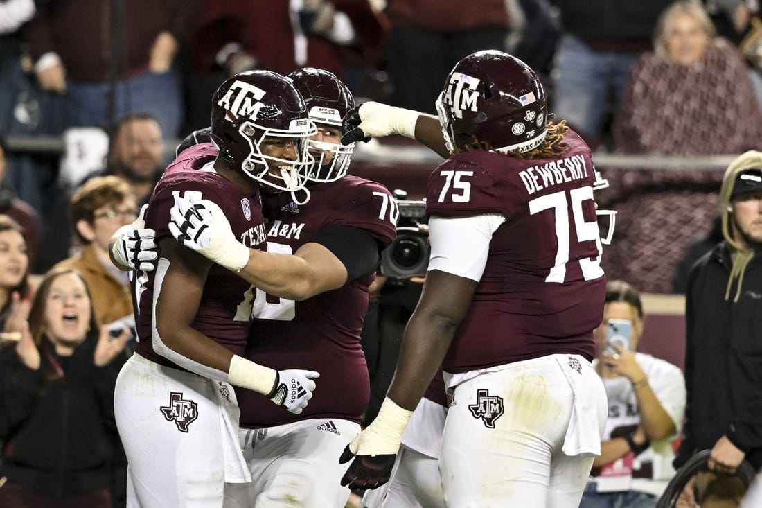 Nov 26, 2022; College Station, Texas, USA;  Texas A&M Aggies tight end Donovan Green (18) celebrates his touchdown during the second quarter against the LSU Tigers at Kyle Field. Mandatory Credit: Maria Lysaker-USA TODAY Sports
