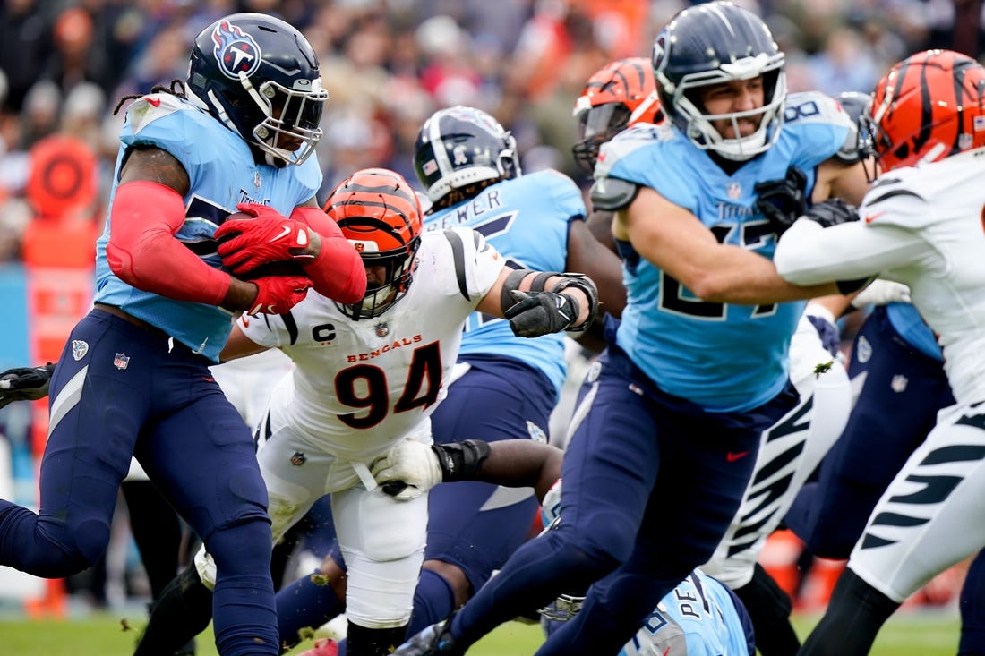 Nov 27, 2022; Nashville, Tennessee, USA; Tennessee Titans running back Derrick Henry (22) carries the ball as they face the Cincinnati Bengals during the second quarter at Nissan Stadium. Mandatory Credit: George Walker IV-USA TODAY Sports