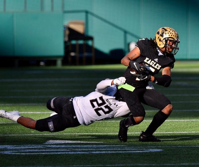 Abilene High receiver Frederick Johnson (7) tries to break a tackle of Denton Guyer's Peyton Bowen (22) during the first half of Saturday's Region I-6A Division II semifinal at Globe Life Park in Arlington.

Ahs Fb Dguyer Halftime