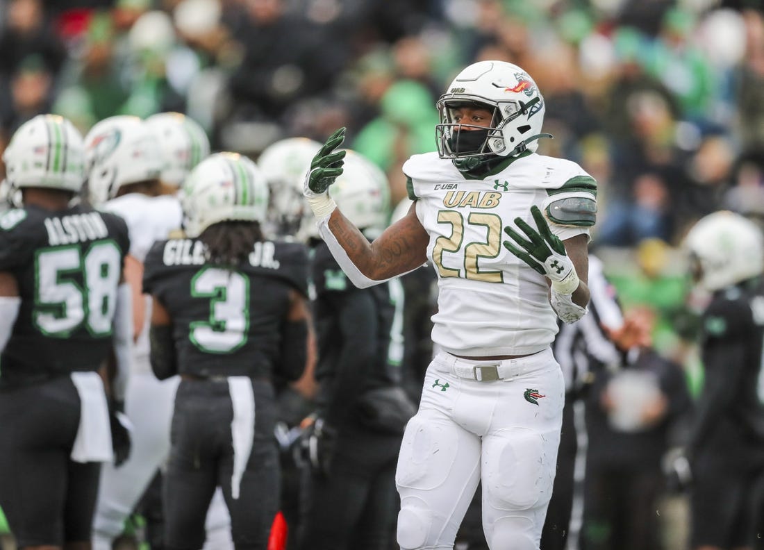 Nov 13, 2021; Huntington, West Virginia, USA; UAB Blazers running back DeWayne McBride (22) celebrates after running for a touchdown during the first quarter against the Marshall Thundering Herd at Joan C. Edwards Stadium. Mandatory Credit: Ben Queen-USA TODAY Sports