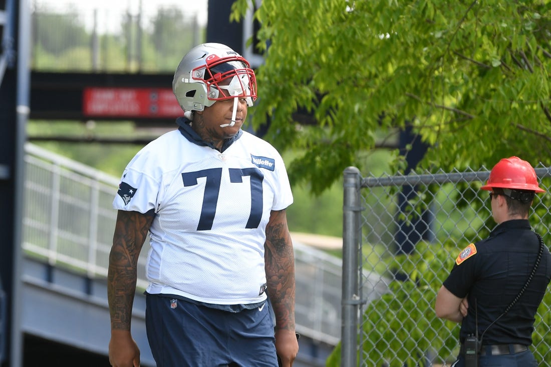 May 23, 2022; Foxborough, MA, USA; New England Patriots offensive tackle Trent Brown (77) walks to the practice field for the team's OTA at Gillette Stadium. Mandatory Credit: Eric Canha-USA TODAY Sports
