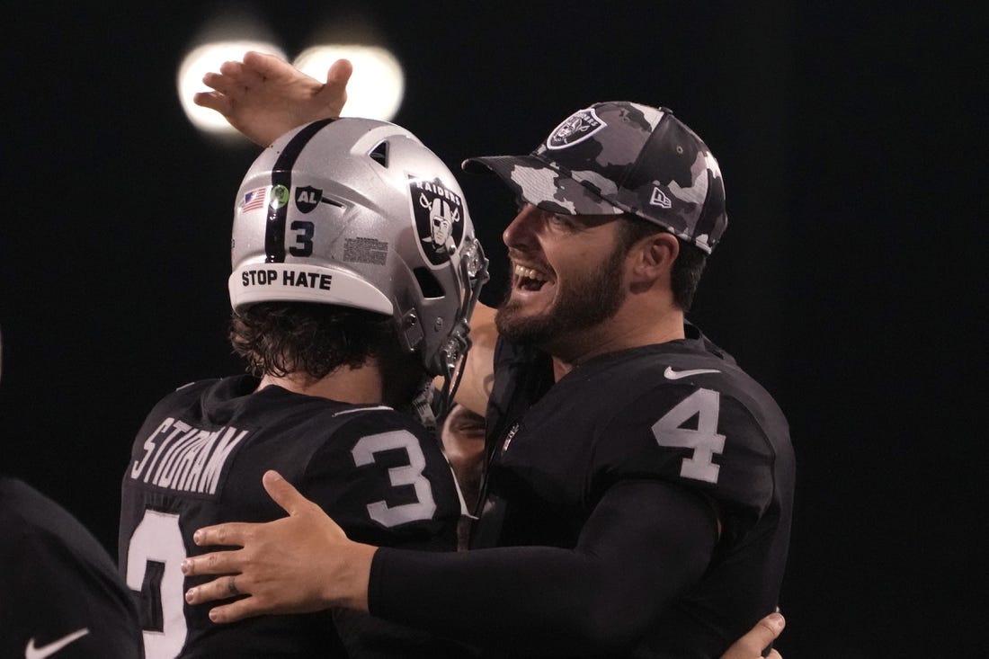 Aug 4, 2022; Canton, Ohio, USA; Las Vegas Raiders quarterback Jarrett Stidham (3) celebrates his touchdown in the second quarter with quarterback Derek Carr (4) during the Hall of Fame game against the Jacksonville Jaguars at Tom Benson Hall of Fame Stadium. Mandatory Credit: Kirby Lee-USA TODAY Sports