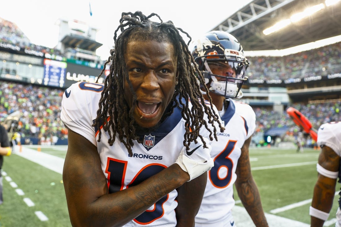 Sep 12, 2022; Seattle, Washington, USA; Denver Broncos wide receiver Jerry Jeudy (10) celebrates on the sideline after catching a touchdown pass against the Seattle Seahawks during the second quarter at Lumen Field. Mandatory Credit: Joe Nicholson-USA TODAY Sports