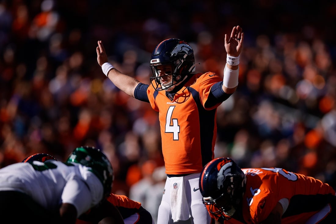 Oct 23, 2022; Denver, Colorado, USA; Denver Broncos quarterback Brett Rypien (4) motions at the line of scrimmage in the first quarter against the New York Jets at Empower Field at Mile High. Mandatory Credit: Isaiah J. Downing-USA TODAY Sports