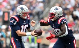 Nov 6, 2022; Foxborough, Massachusetts, USA; New England Patriots quarterback Mac Jones (10) hands the ball off to running back Rhamondre Stevenson (38) during the first half of a game against the Indianapolis Colts  at Gillette Stadium. Mandatory Credit: Brian Fluharty-USA TODAY Sports
