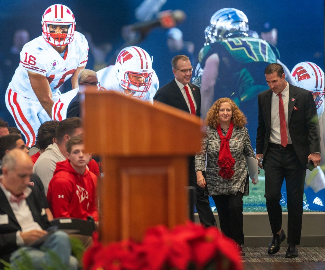 New Wisconsin head football coach Luke Fickell, right, joins  athletic director Chris McIntosh, left, and Chancellor Jennifer Mnookin at a welcome event Monday, November 28, 2022. at Camp Randall Stadium in Madison, Wis. He was previously head coach for six seasons at Cincinnati.MARK HOFFMAN/MILWAUKEE JOURNAL SENTINEL

Mjs Uwgrid28 4 Jpg Uwgrid Fickell
