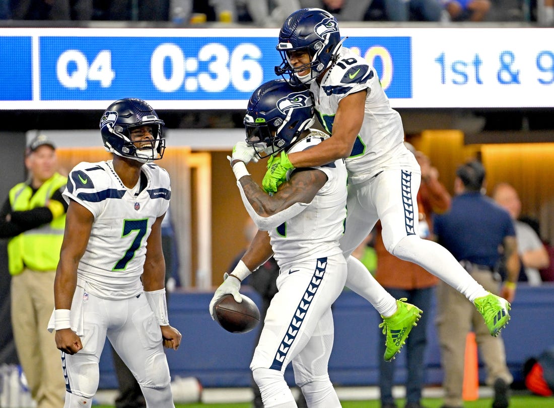 Dec 4, 2022; Inglewood, California, USA;  Seattle Seahawks wide receiver Tyler Lockett (16) celebrates with quarterback Geno Smith (7) and wide receiver DK Metcalf (14) after a touchdown in the fourth quarter against the Los Angeles Rams at SoFi Stadium. Mandatory Credit: Jayne Kamin-Oncea-USA TODAY Sports