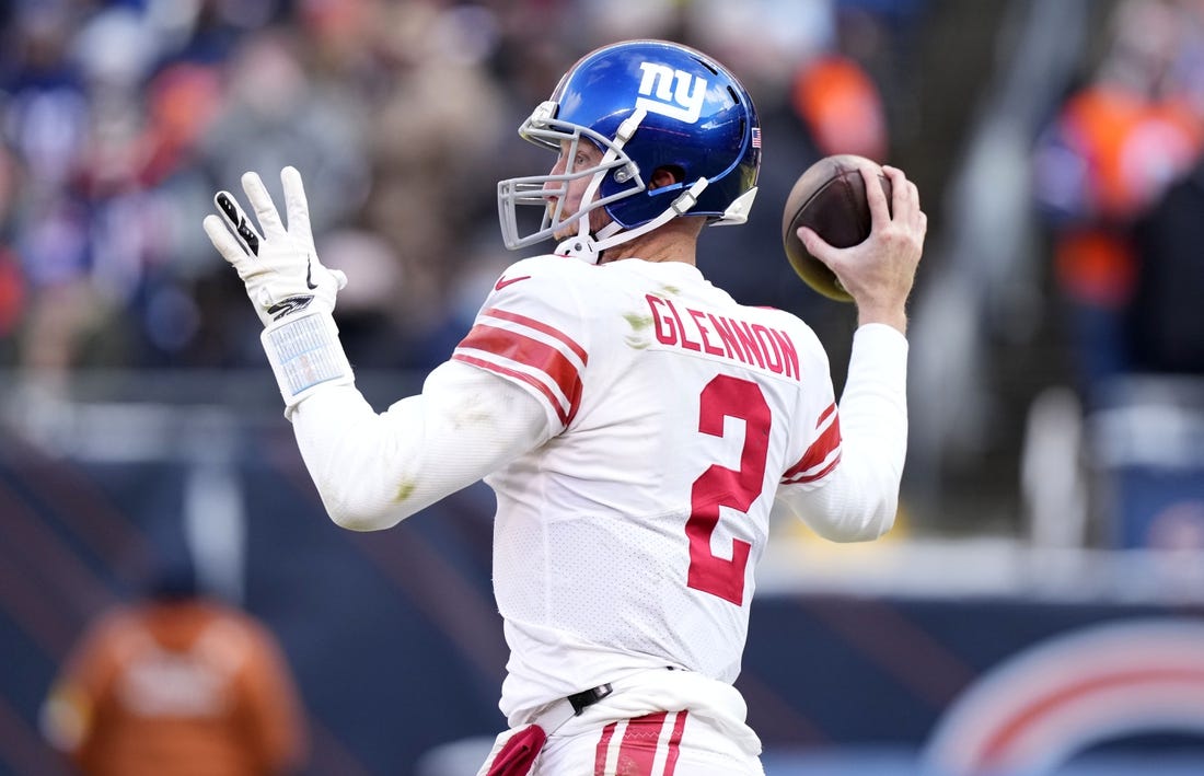 Jan 2, 2022; Chicago, Illinois, USA; New York Giants quarterback Mike Glennon (2) drops back to pass against the Chicago Bears during the second half at Soldier Field. Mandatory Credit: Mike Dinovo-USA TODAY Sports