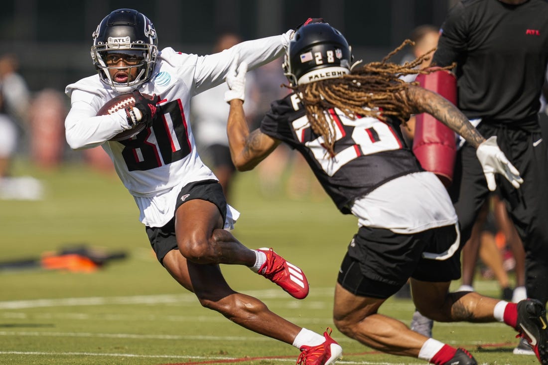 Jul 29, 2022; Flowery Branch, GA, USA; Atlanta Falcons wide receiver Cameron Batson (80) runs against defensive back Mike Ford (28) during training camp at IBM Performance Field. Mandatory Credit: Dale Zanine-USA TODAY Sports