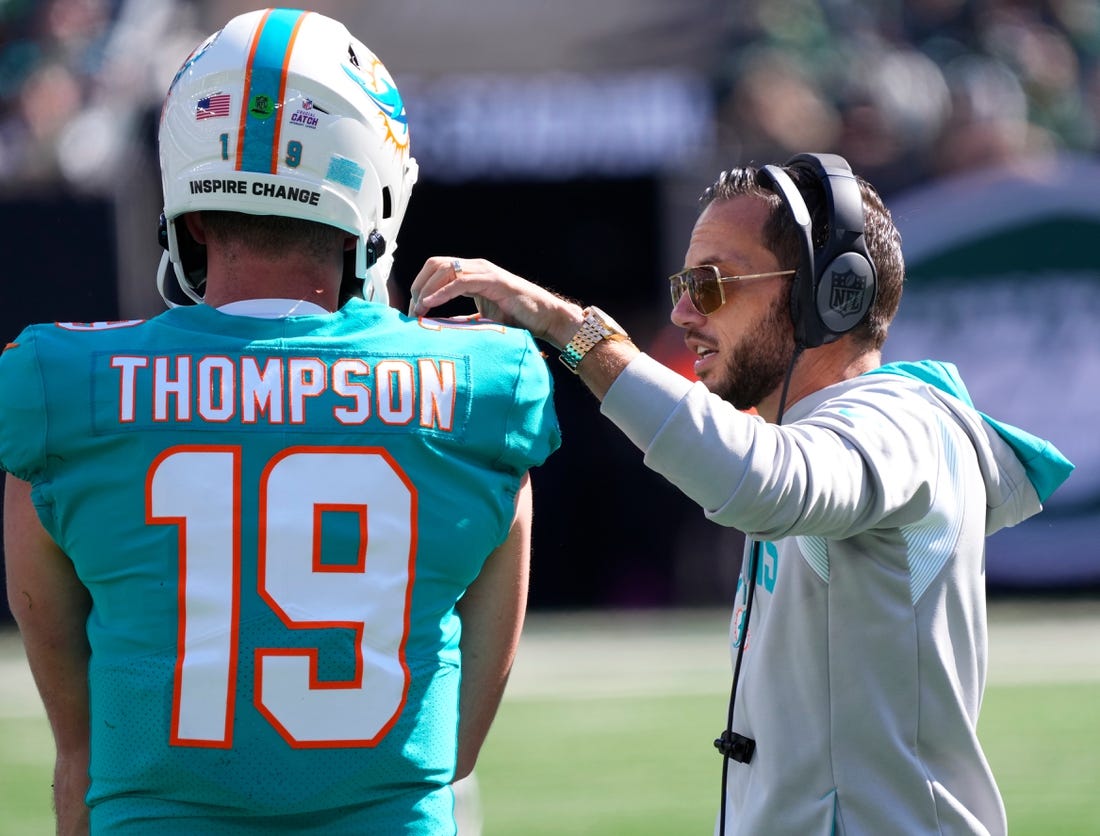Oct 9, 2022; East Rutherford, New Jersey, USA; Miami Dolphins head coach Mike McDaniel talks with quarterback Skylar Thompson (19) between plays against the New York Jets during the first half at MetLife Stadium. Mandatory Credit: Robert Deutsch-USA TODAY Sports