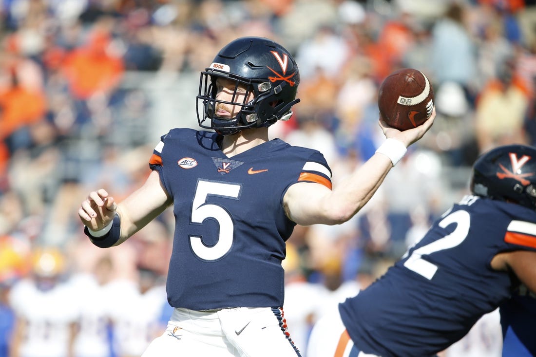 Nov 12, 2022; Charlottesville, Virginia, USA; Virginia Cavaliers quarterback Brennan Armstrong (5) throws the ball against the Pittsburgh Panthers during the first half at Scott Stadium. Mandatory Credit: Amber Searls-USA TODAY Sports