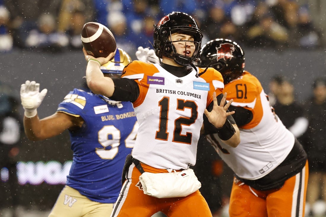 Nov 13, 2022; Winnigeg, Manitoba, CAN; BC Lions quarterback Nathan Rourke (12) throws against the Winnipeg Blue Bombers in the first half at Investors Group Field. Mandatory Credit: James Carey Lauder-USA TODAY Sports