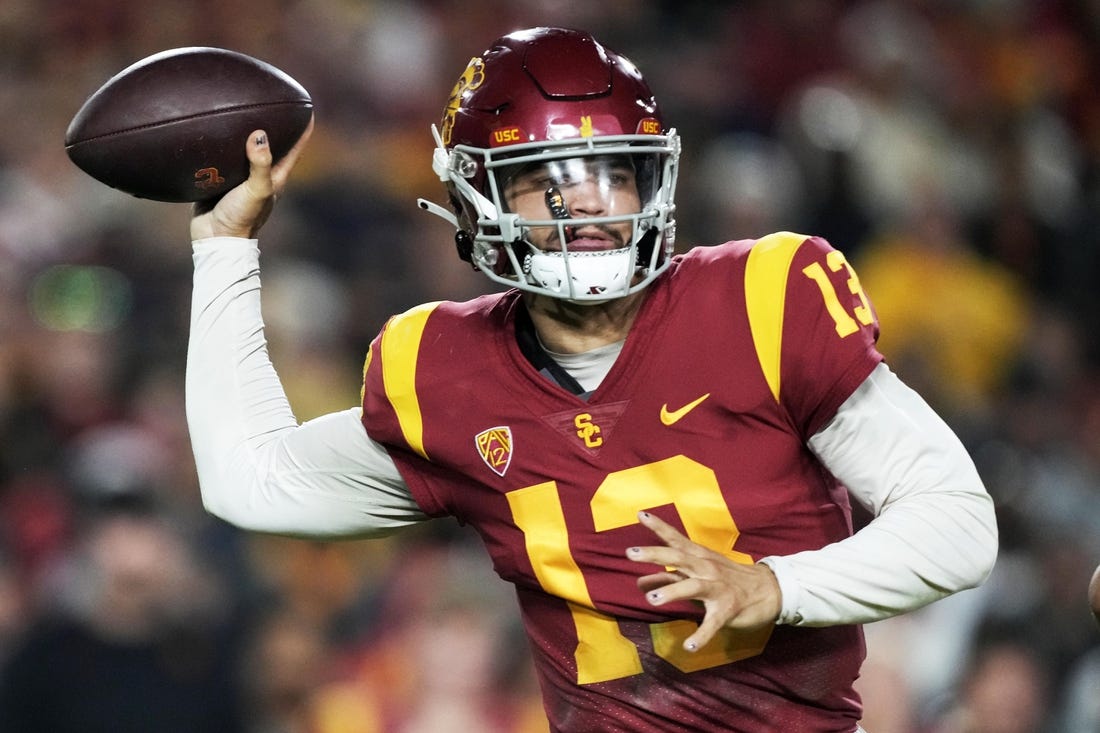 Nov 26, 2022; Los Angeles, California, USA; Southern California Trojans quarterback Caleb Williams (13)  throws the ball against the Notre Dame Fighting Irish in the first half at United Airlines Field at Los Angeles Memorial Coliseum. Mandatory Credit: Kirby Lee-USA TODAY Sports
