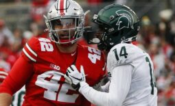 Michigan State Spartans cornerback Khary Crump (14) and Ohio State Buckeyes long snapper Bradley Robinson (42) share words after a punt return.

Syndication The Columbus Dispatch