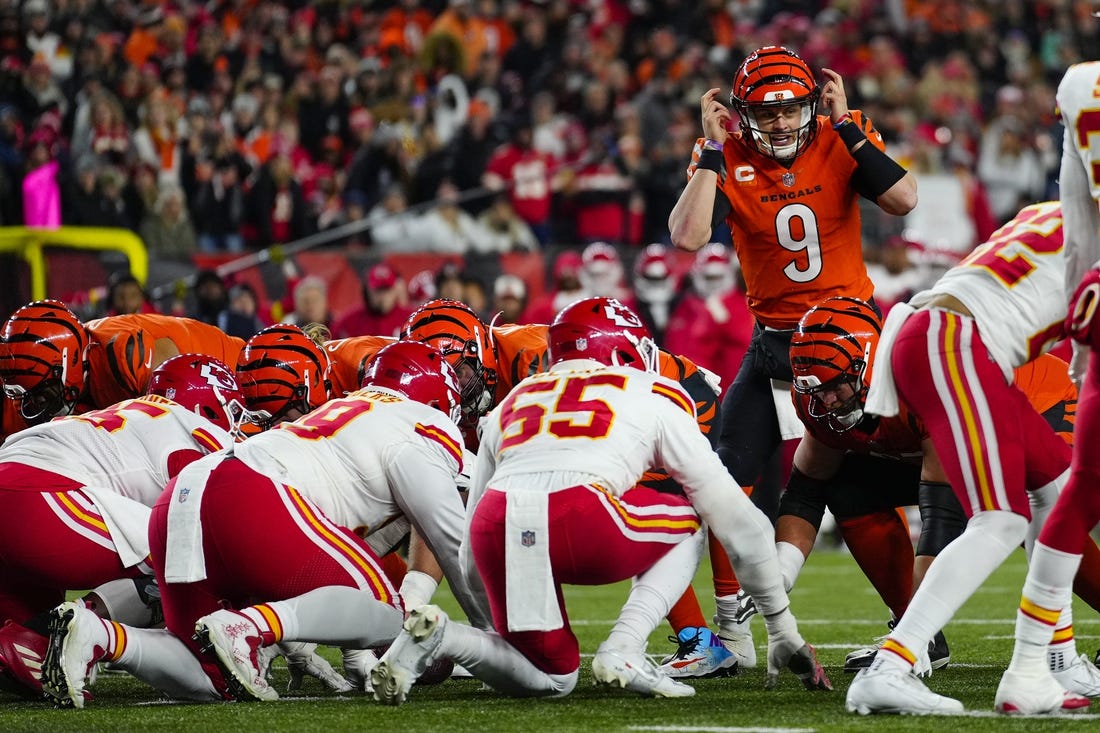 Dec 4, 2022; Cincinnati, Ohio, USA; Cincinnati Bengals quarterback Joe Burrow (9) makes an adjustment as the Bengals go for it on 4th and 1 in the second quarter of a Week 13 NFL game at Paycor Stadium. Mandatory Credit:Sam Greene-USA TODAY Sports