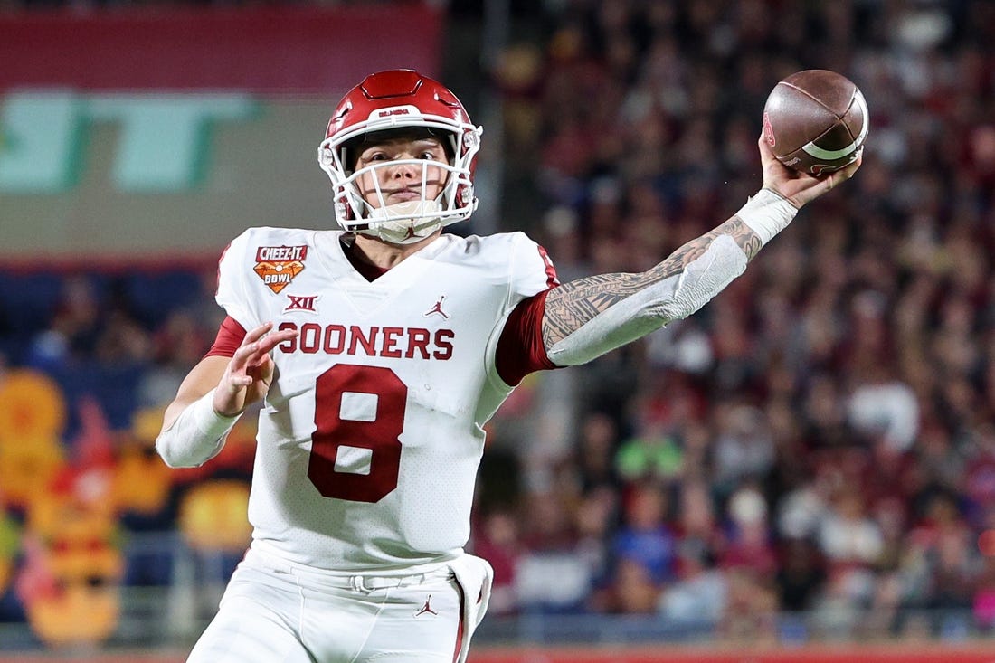 Dec 29, 2022; Orlando, Florida, USA; Oklahoma Sooners quarterback Dillon Gabriel (8) throws a pass against the Florida State Seminoles in the fourth quarter during the 2022 Cheez-It Bowl at Camping World Stadium. Mandatory Credit: Nathan Ray Seebeck-USA TODAY Sports