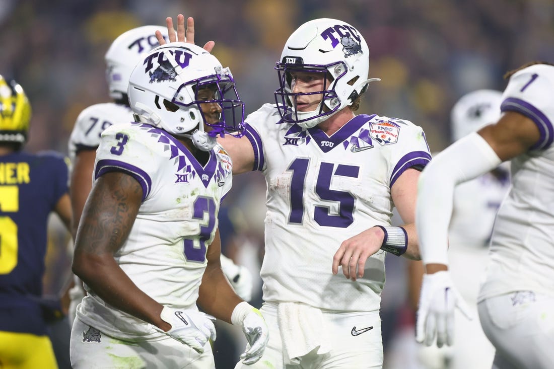 Dec 31, 2022; Glendale, Arizona, USA; TCU Horned Frogs running back Emari Demercado (3) celebrates after making a touchdown with quarterback Max Duggan (15) against the Michigan Wolverines in the third quarter of the 2022 Fiesta Bowl at State Farm Stadium. Mandatory Credit: Mark J. Rebilas-USA TODAY Sports