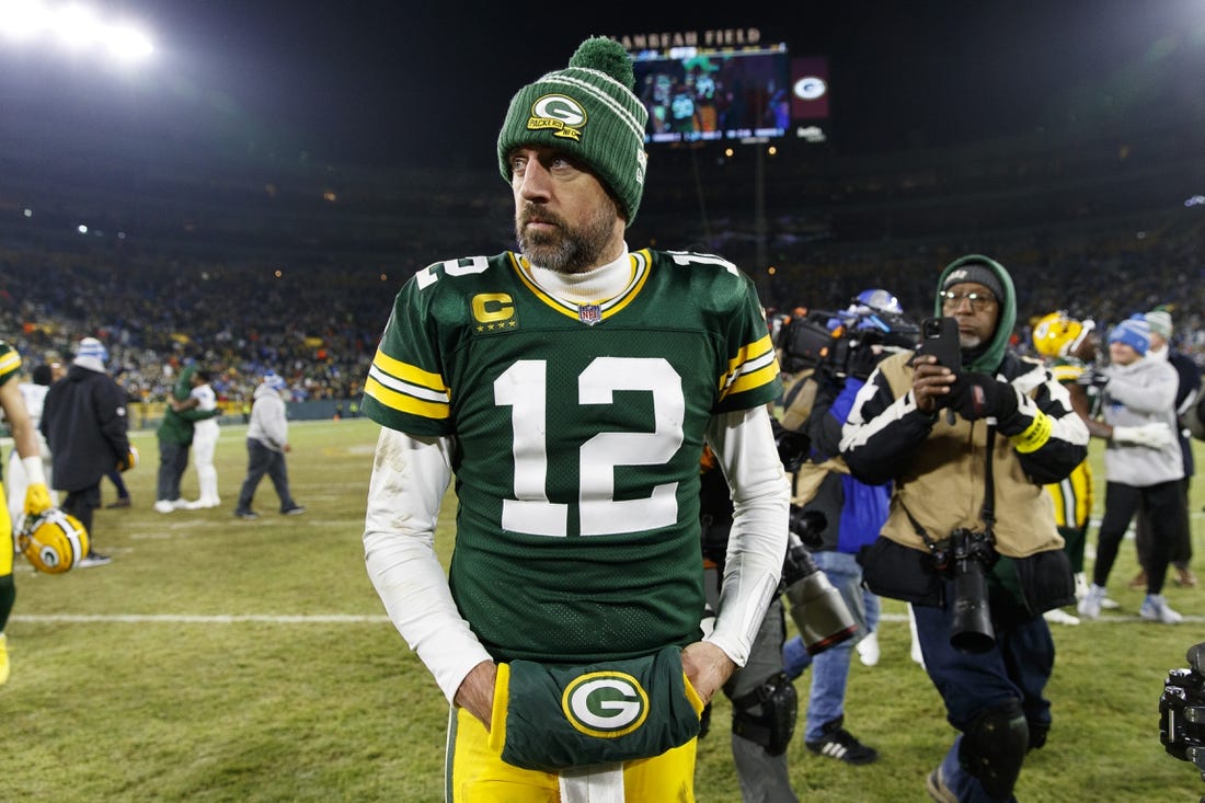 Jan 8, 2023; Green Bay, Wisconsin, USA;  Green Bay Packers quarterback Aaron Rodgers (12) walks off the field following the game against the Detroit Lions at Lambeau Field. Mandatory Credit: Jeff Hanisch-USA TODAY Sports