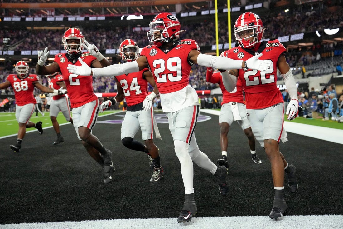 Jan 9, 2023; Inglewood, CA, USA; Georgia Bulldogs defensive back Christopher Smith (29) celebrates after defensive back Javon Bullard (22) made an interception against the TCU Horned Frogs during the second quarter of the CFP national championship game at SoFi Stadium. Mandatory Credit: Kirby Lee-USA TODAY Sports
