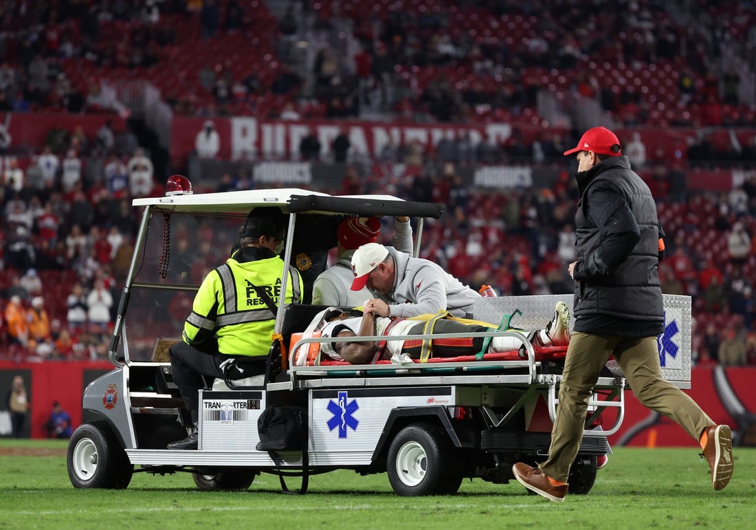 Jan 16, 2023; Tampa, Florida, USA; Tampa Bay Buccaneers wide receiver Russell Gage (17) is placed on a medical cart after a play against the Dallas Cowboys in the second half during the wild card game at Raymond James Stadium. Mandatory Credit: Kim Klement-USA TODAY Sports