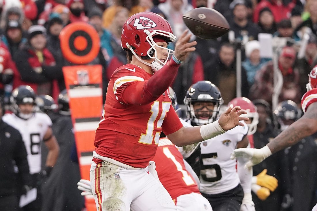 Jan 21, 2023; Kansas City, Missouri, USA; Kansas City Chiefs quarterback Patrick Mahomes (15) throws against the Jacksonville Jaguars during the first half in the AFC divisional round game at GEHA Field at Arrowhead Stadium. Mandatory Credit: Denny Medley-USA TODAY Sports
