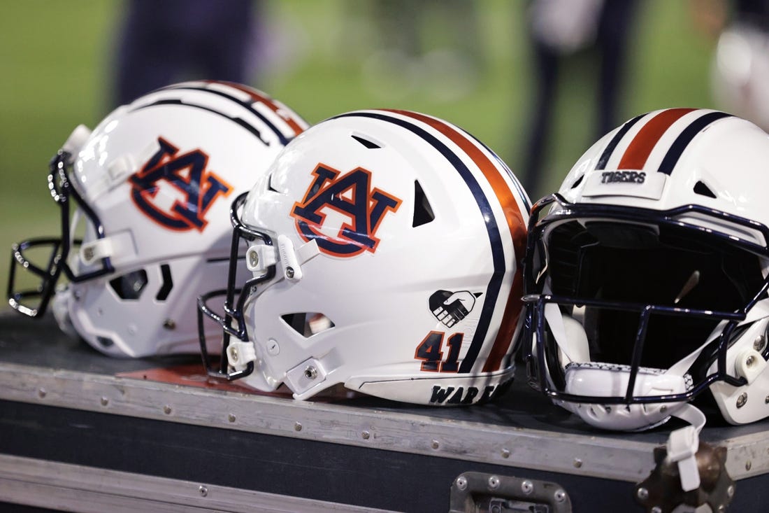 Oct 2, 2021; Baton Rouge, Louisiana, USA; Auburn Tigers helmets sits on a crate during a game against LSU Tigers at Tiger Stadium. Mandatory Credit: Stephen Lew-USA TODAY Sports