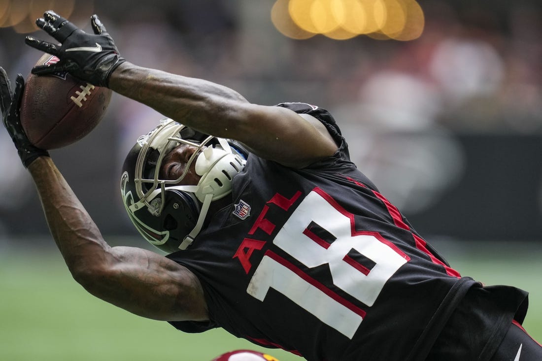 Oct 3, 2021; Atlanta, Georgia, USA; Atlanta Falcons wide receiver Calvin Ridley (18) tries to catch a pass against the Washington Football Team during the second half at Mercedes-Benz Stadium. Mandatory Credit: Dale Zanine-USA TODAY Sports