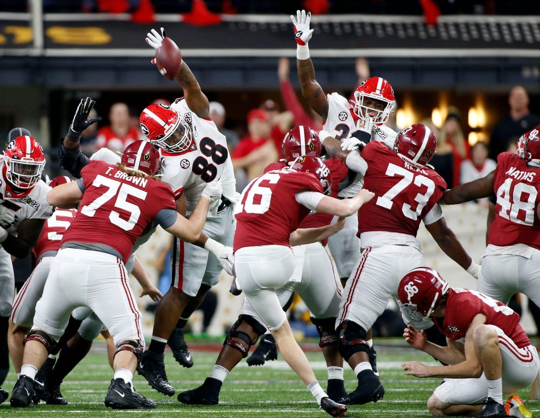Georgia Bulldogs defensive lineman Jalen Carter (88) blocks a field goal attempt by Alabama Crimson Tide place kicker Will Reichard (16) on Monday, Jan. 10, 2022, during the College Football Playoff National Championship at Lucas Oil Stadium in Indianapolis.

Syndication The Indianapolis Star