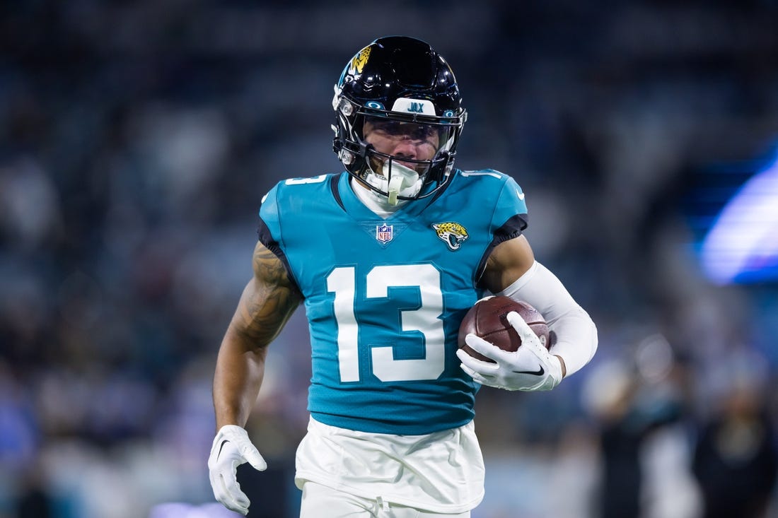 Jan 14, 2023; Jacksonville, Florida, USA; Jacksonville Jaguars wide receiver Christian Kirk (13) against the Los Angeles Chargers during a wild card playoff game at TIAA Bank Field. Mandatory Credit: Mark J. Rebilas-USA TODAY Sports