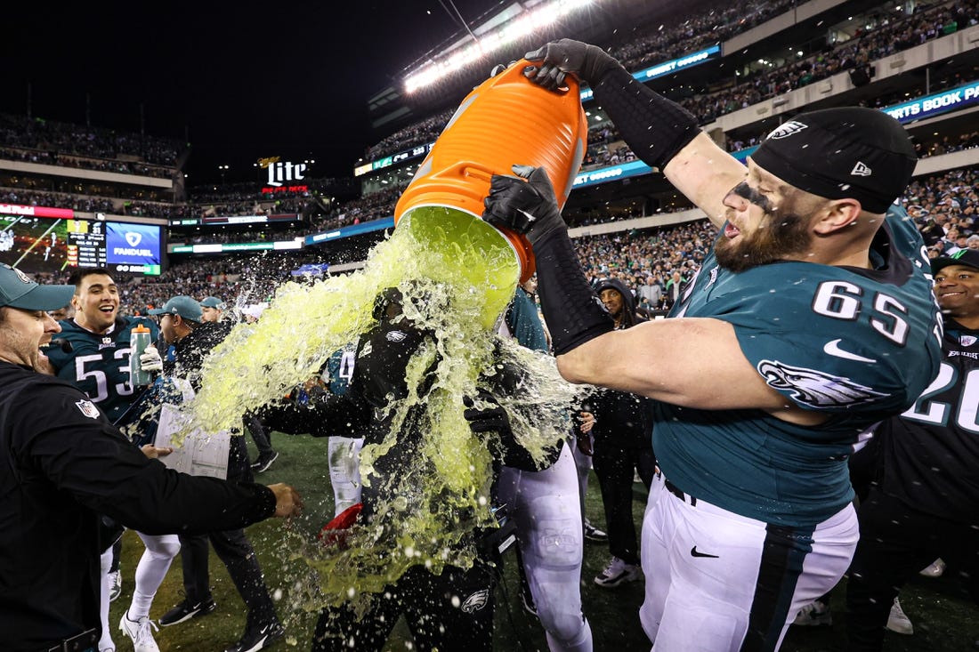 Jan 29, 2023; Philadelphia, Pennsylvania, USA; Philadelphia Eagles offensive tackle Lane Johnson (65) dumps gatorade on head coach Nick Sirianni in the final minutes of a victory against the San Francisco 49ers in the NFC Championship game at Lincoln Financial Field. Mandatory Credit: Bill Streicher-USA TODAY Sports