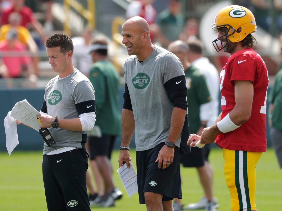 New York Jets offensive coordinator Mike LaFleur, left, head coach Robert Saleh and Green Bay Packers quarterback Aaron Rodgers (12) participate in training camp Wednesday.

Ar Saleh Mike