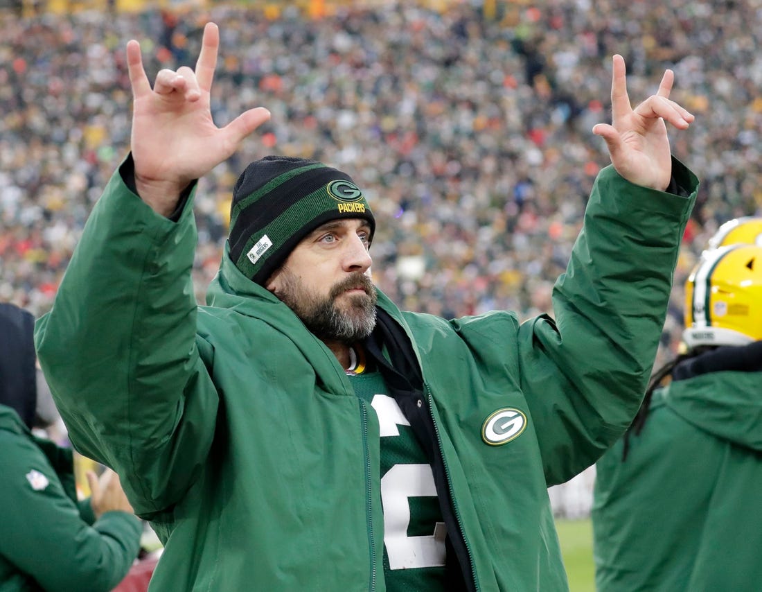Green Bay Packers quarterback Aaron Rodgers (12) acknowledges the fans after he broke Brett Favre's team record for touchdown passes Sunday.

Syndication Packersnews